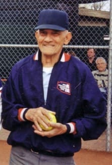 A man holding a ball in his hands.